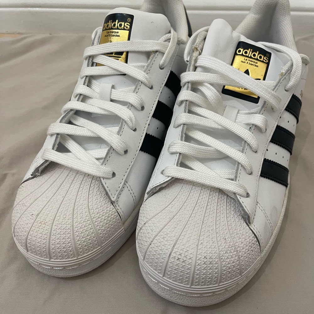 Adidas White Sneakers with Black Stripes and Gold Accents/ never worn